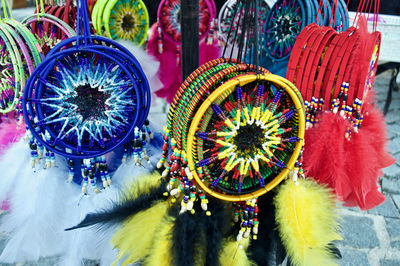 Close-up of multi colored decorations hanging at market stall