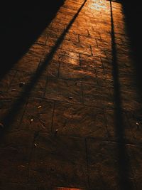 High angle view of shadow on hardwood floor