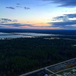 Scenic view of landscape against sky at sunset