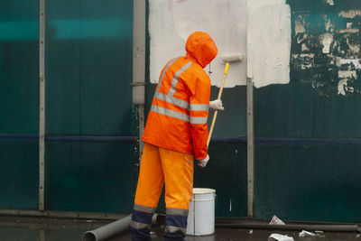 Rear view of man working