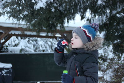 Rear view of girl in snow