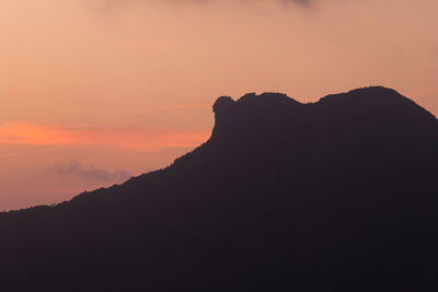 Silhouette mountain against sky during sunset