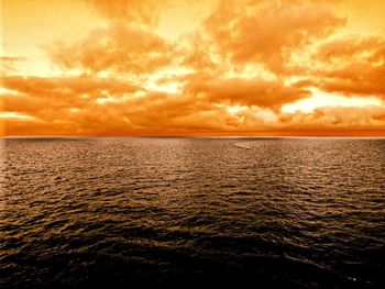 Scenic view of sea against dramatic sky