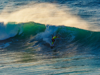 People surfing in sea