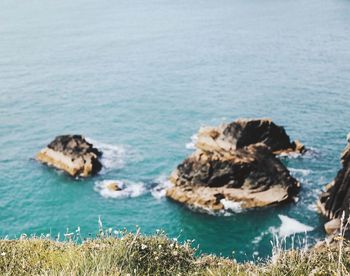 High angle view of rocks in sea