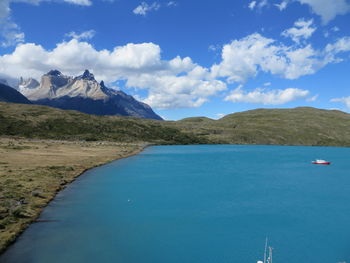 Scenic view of lake and mountains against sky