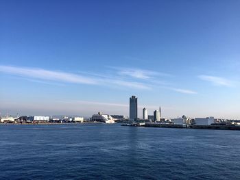 City skyline against blue sky