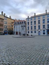 Buildings in city against sky