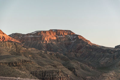 Rock formations on mountain against sky