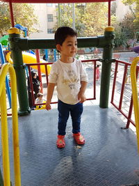 Girl standing on jungle gym