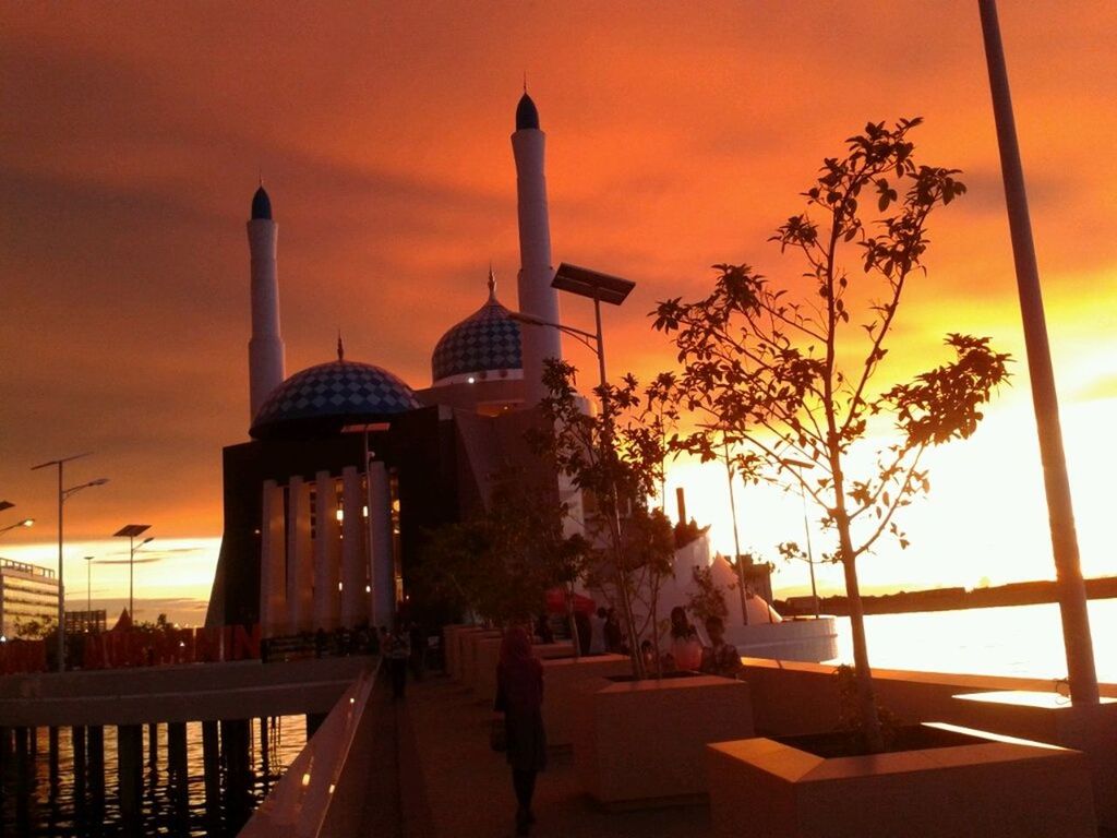 sunset, orange color, architecture, built structure, silhouette, sky, sun, building exterior, palm tree, water, sea, cloud - sky, beauty in nature, tourism, nature, tourist, incidental people, scenics, travel destinations