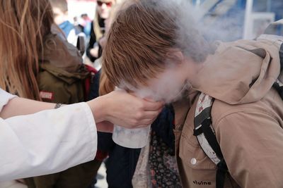 Boy inhaling steam