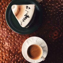 High angle view of coffee cup on table