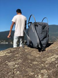 Rear view of man looking at sea