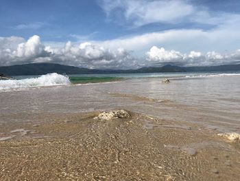 Scenic view of beach against sky