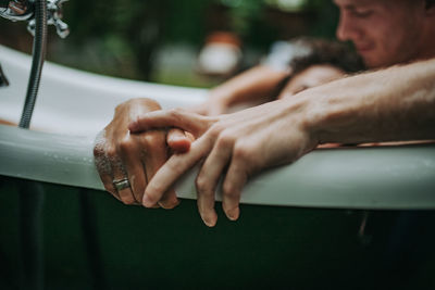 Close-up of man hands on car