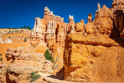 Rock formations against blue sky