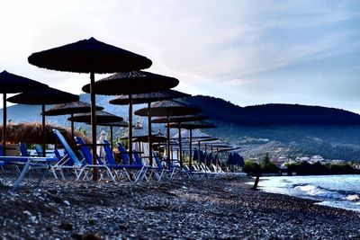 Built structure on beach against sky