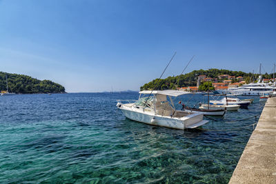 Scenic view of sea against clear blue sky