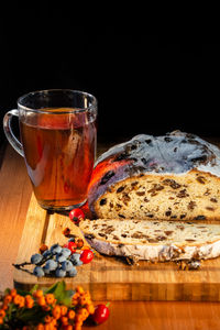 Close-up of drink on table against black background