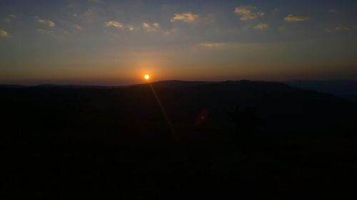 Scenic view of landscape against sky during sunset