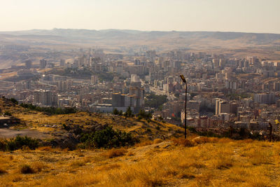 High angle view of buildings in city against sky
