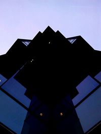 Low angle view of building against blue sky