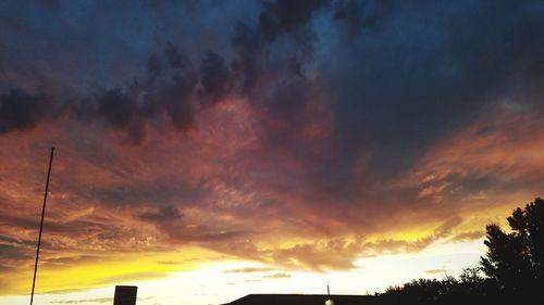 Low angle view of cloudy sky at sunset