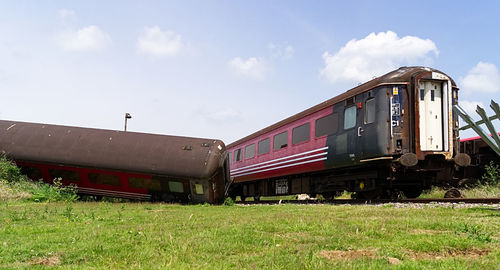 Train on railroad track against sky