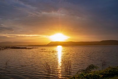 Scenic view of lake against sky during sunset