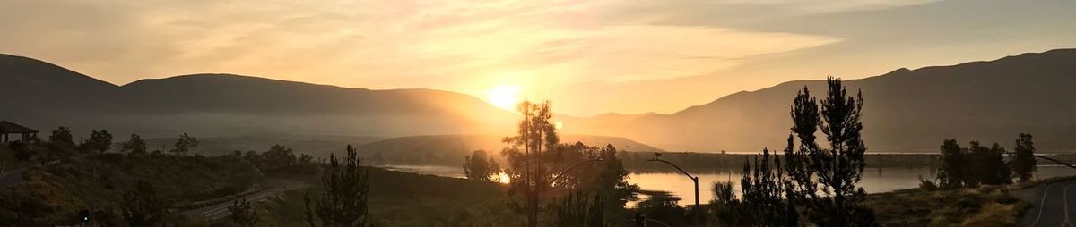 Panoramic view of landscape against sky during sunset