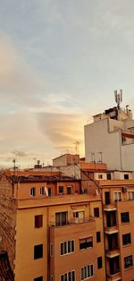 Low angle view of buildings in city against sky