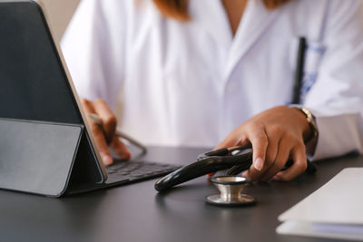 Man using laptop on table