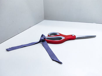 High angle view of eyeglasses on table against white background