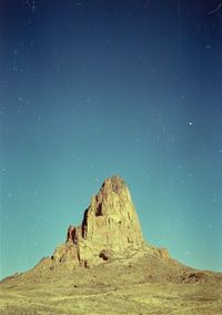 Scenic view of mountain against sky at night