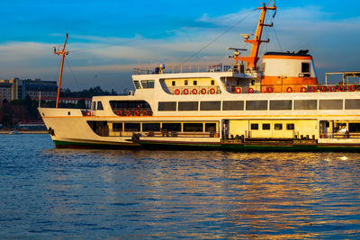 Istanbul city lines ferry near the kadikoy pier at sunset.