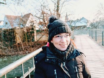 Portrait of smiling young woman in winter