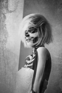 Portrait of woman in skeleton standing