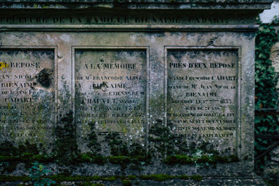 Information sign on old wall