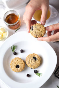 Midsection of person holding cookies