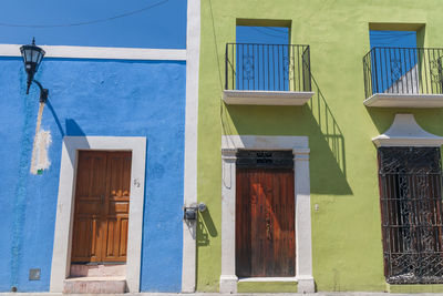 Low angle view of house against blue sky
