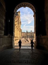 People in front of historical building