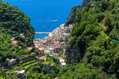 High angle view of buildings by sea