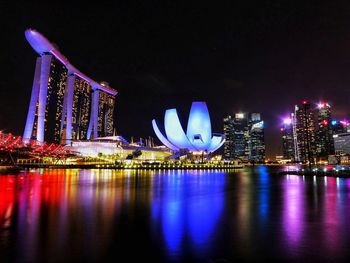 Illuminated city at waterfront