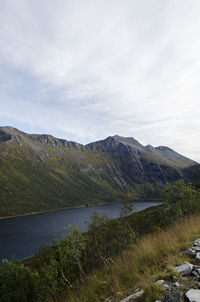 Scenic view of lake and mountains against sky