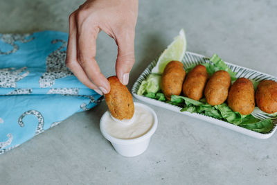 High angle view of person preparing food on table