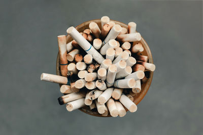 High angle view of cigarette on table against black background