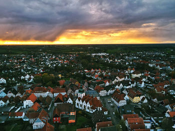 High angle view of townscape against sky at sunset