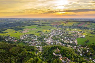 Aerial view of townscape against sky during sunset