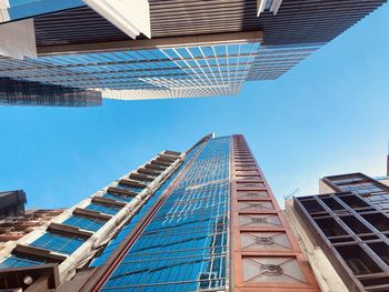 Low angle view of modern buildings against sky